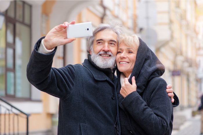 An older couple take a selfie
